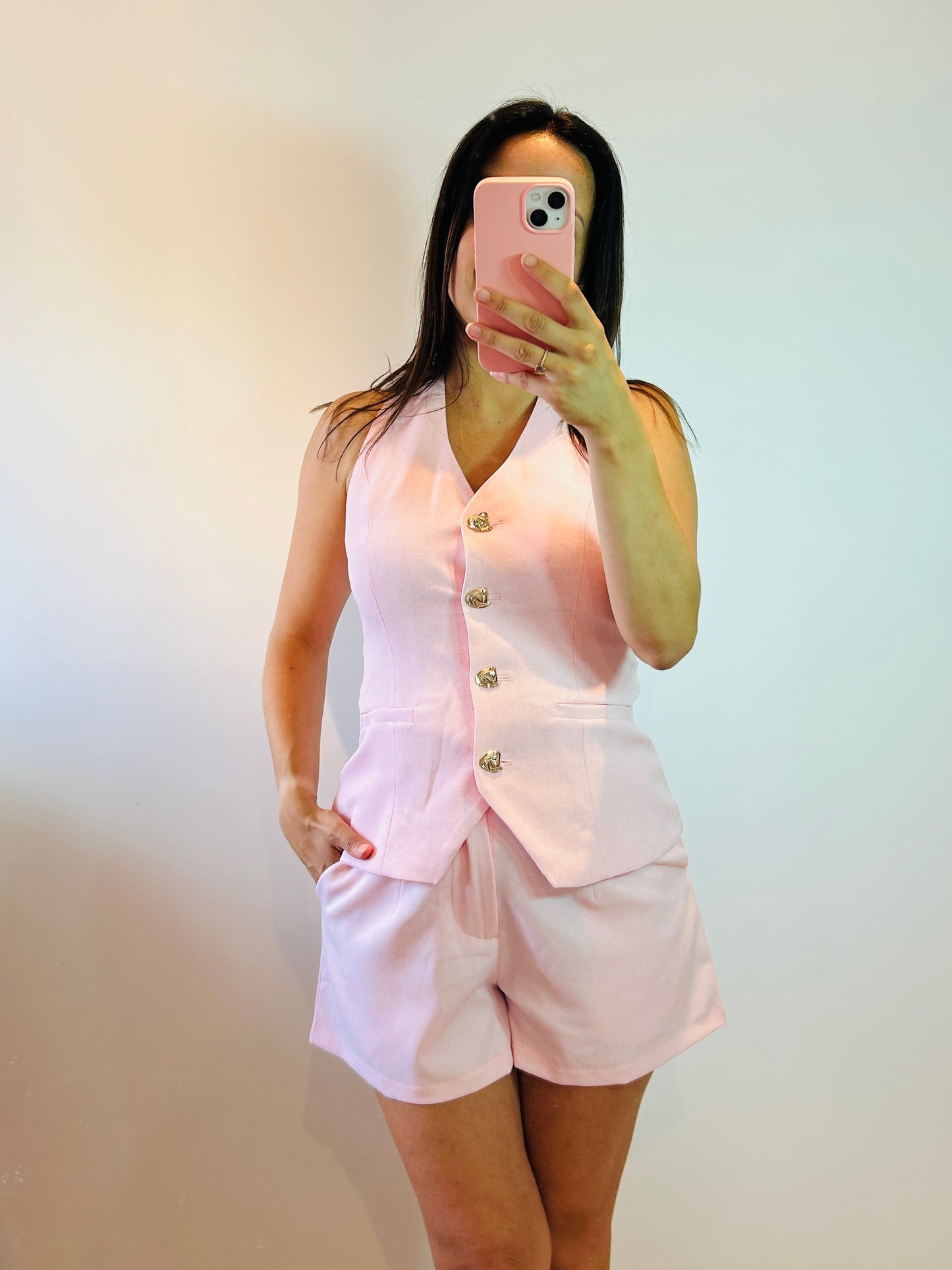 Short pink golden button