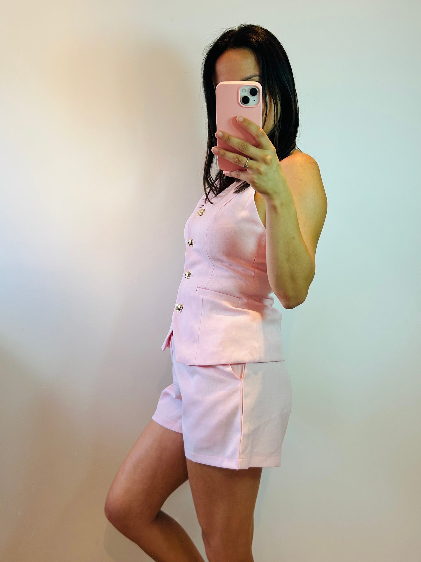 Short pink golden button